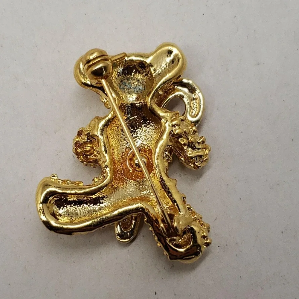Vintage gold tone Christmas BEAR w/ rhinestone eyes enamel candy cane brooch pin